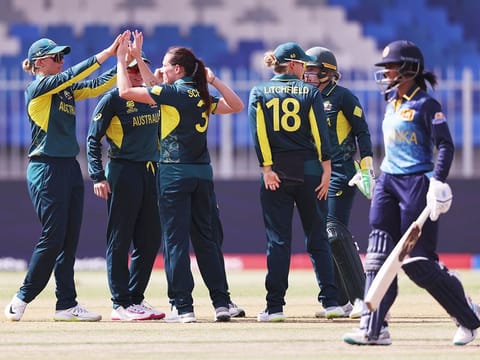 Australian mediumpacer Megan Schutt celebrates with teammates after claiming a Sri Lankan wicket in a Group A match in the Women’s T20 World Cup in Sharjah on October 5, 2024. Australia won by six wickets.