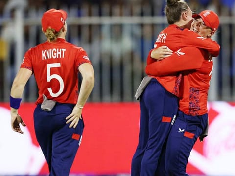 England left-arm spinner Linsey Smith (second left) celebrates after taking a Bangladesh wicket in the Group B match of the Women’s T20 World Cup cricket tournament, in Sharjah on October 5. England won by 21 runs.