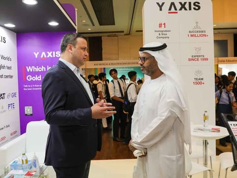Clint Khan, Director of Y-Axis (Left), interacting with AlMehdar Ahmed, Head of Higher Education Classification & Rating Framework, Knowledge & Human Development Authority (KHDA), at the Y-Axis booth at Gulf News Edufair
