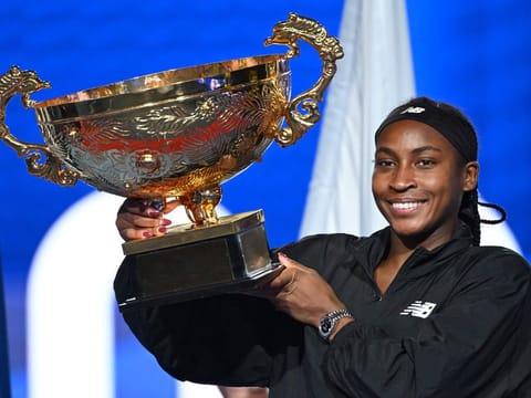 USA's Coco Gauff celebrates with the trophy after winning the women's singles final match against Czech Republic's Karolina Muchova at the China Open tennis tournament in Beijing on Sunday.