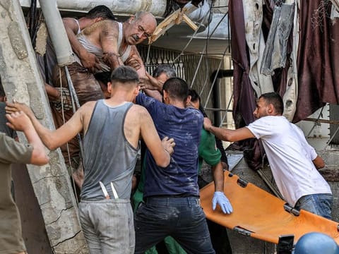 A man is extricated from the rubble of a collapsed building following Israeli bombardment after his rescue in the Saftawi district in Jabalia in the northern Gaza Strip on October 15, 2024.