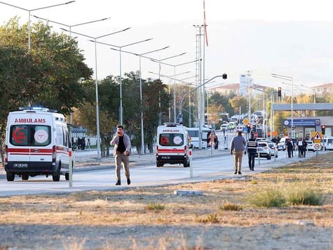 Ambulances drive in Kahramankazan, some 40 kilometers north of Ankara, near the gate of the Turkish Aerospace Industries (TAI).