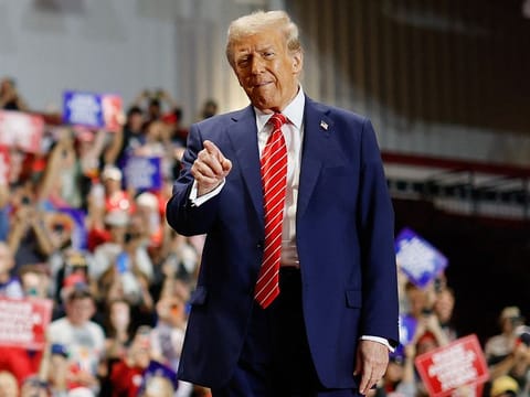 Republican presidential nominee, former US President Donald Trump greets supporters during a campaign event at the Rocky Mount Event Center on October 30, 2024 in Rocky Mount, North Carolina.