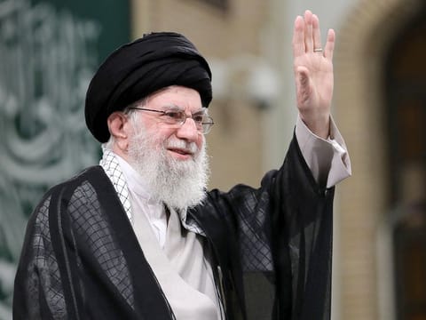 A handout picture provided by the office of Iran's supreme leader Ayatollah Ali Khamenei on November 2, 2024, shows him waving to the crowd during a meeting with Iranian students in Tehran. Khamenei vowed to respond to attacks on Iran and its allies.