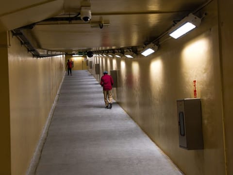 People using Bur Dubai-Deira underwater walking tunnel.