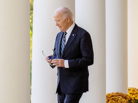 US President Joe Biden walks out of the Oval Office in Washington, DC.