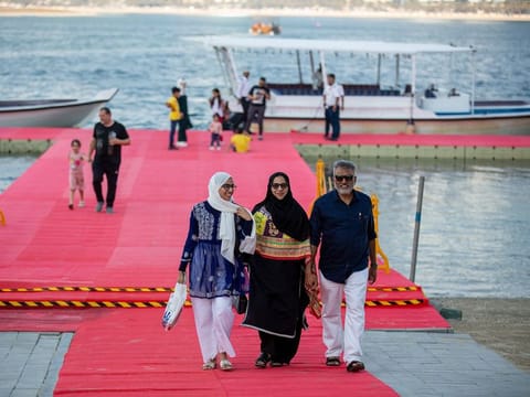Guests arrive at the temporary dock in the lagoon behind Expo Centre Sharjah, where the book fair is being held till November 17