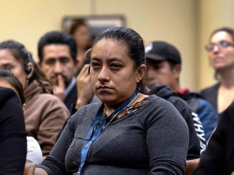 Immigrant families, rights groups and concerned citizens attend a meeting with state and local officials to discuss the uncertain future following President-elect Donald Trump's deportation plan in Stamford, Connecticut.