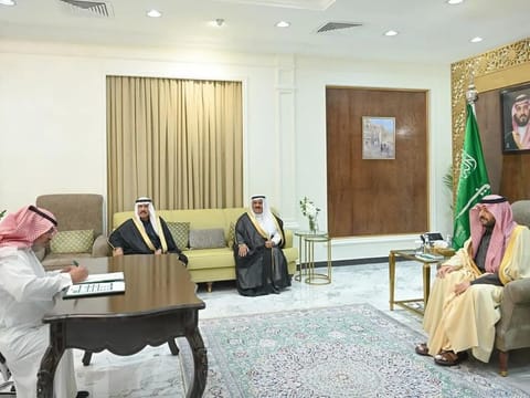 Musab Al Enazi signs a waiver of retribution at the Northern Border governor's office.
