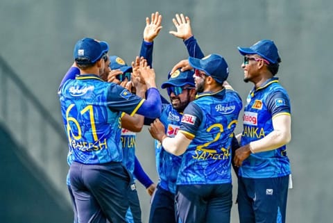 Sri Lanka's captain Charith Asalanka (centre) celebrates with teammates after taking a catch to dismiss New Zealand's Tim Robinson during the third and final One-Day International cricket match at the Pallekele International Cricket Stadium in Kandy on November 19.