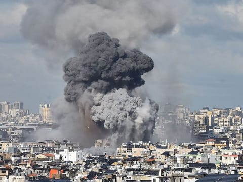 Smoke billows above Beirut’s southern suburbs following an Israeli airstrike on November 26, 2024, amid the ongoing war between Israel and Hezbollah.