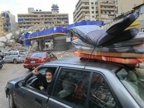 People return with their belongings to their homes in Beiruts southern suburbs on November 27, 2024, after a ceasefire between Israel and Hezbollah took effect.