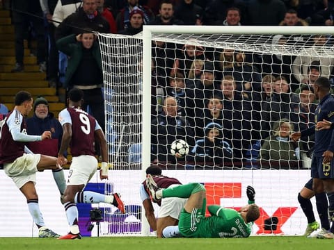 Aston Villa's midfielder Morgan Rogers (L) scores, but the goal is disallowed, during the UEFA Champions League football match against Juventus at Villa Park in Birmingham, central England, on November 27, 2024.