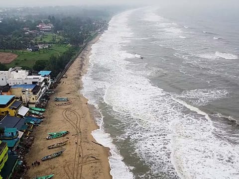 Aerial view of high tide and waves lashing at the shores of Mahabalipuram, Tamil Nadu, on Friday.