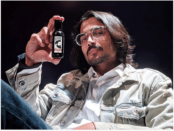 A screenshot of Bhuvan Bam posing with a bottle of Beardo on Instagram