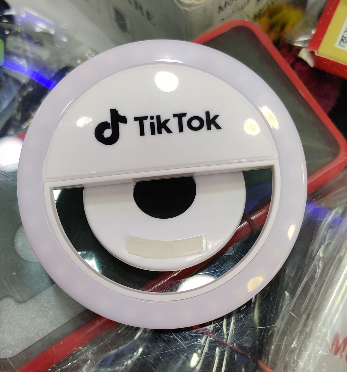 A ring light with TikTok branding on it