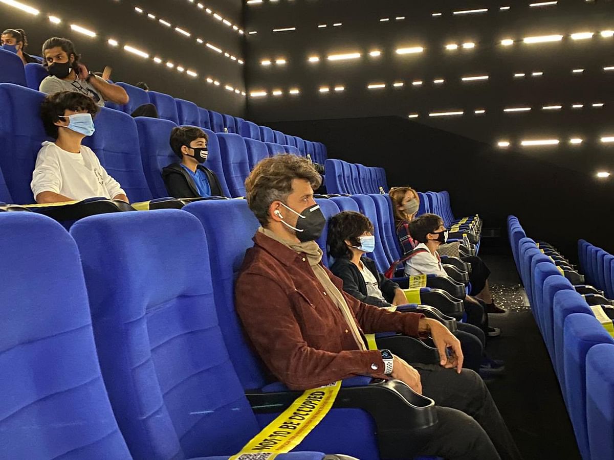 Hrithik Roshan sitting a seat apart from his son with whom he lives in the same house