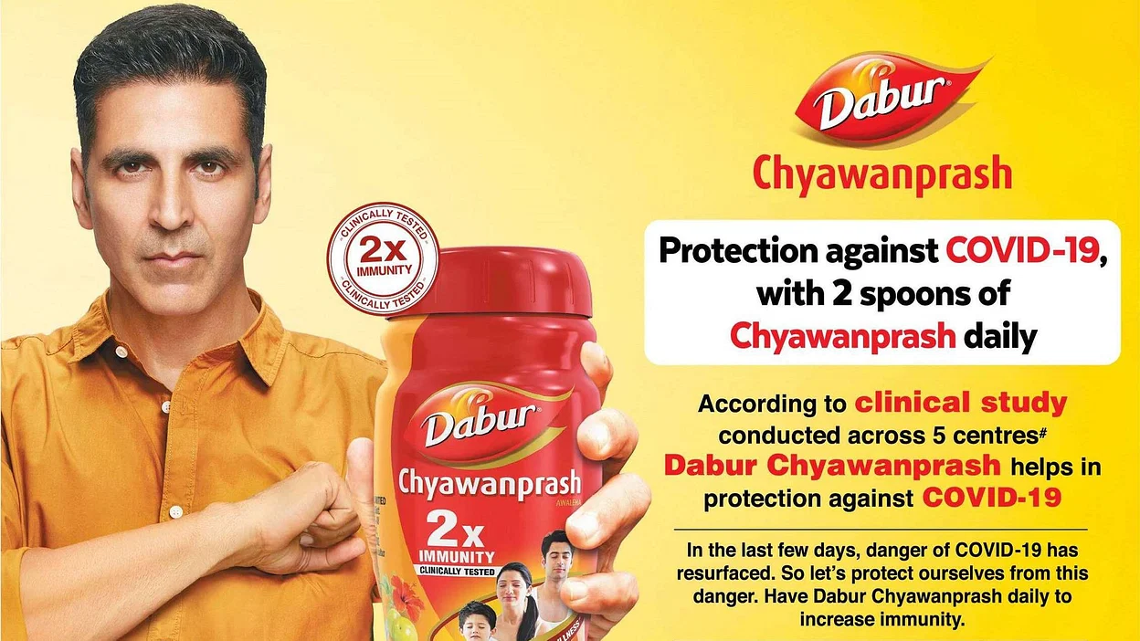 Dabur ad says, "Protection against COVID-19 with 2 spoons of Chyawanprash  daily"...