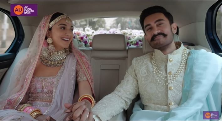 AU Bank's ad, starring Aamir Khan and Kiara Advani, is under fire for  hurting religious sentiments