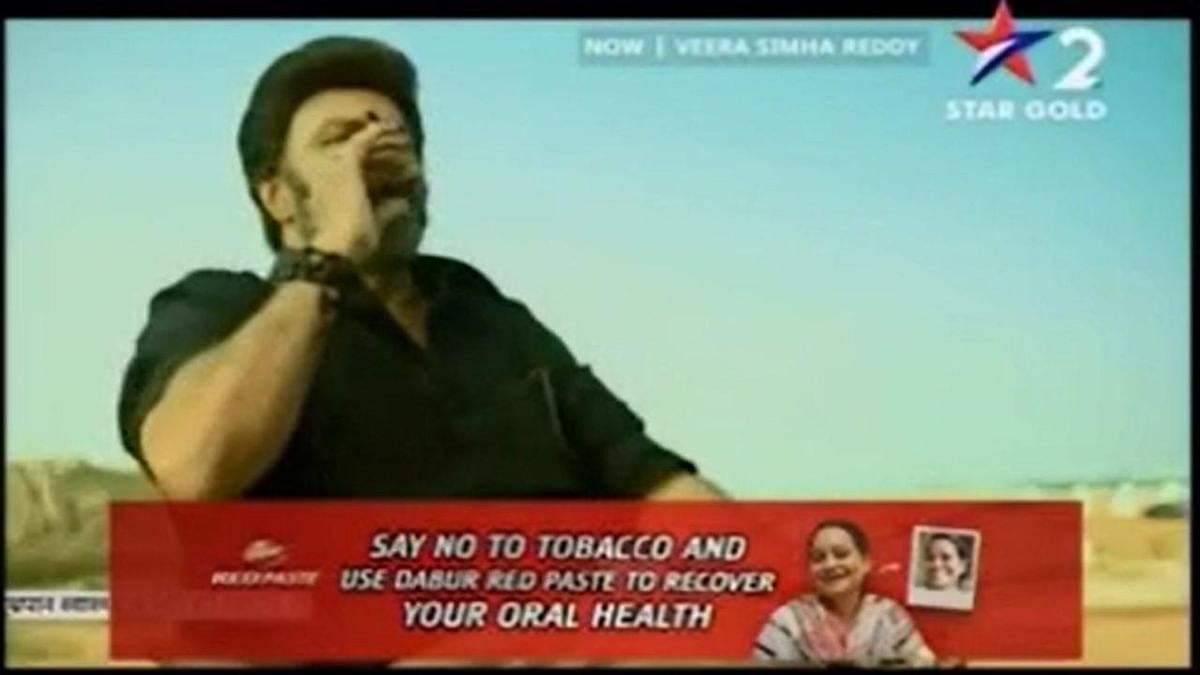 Dabur advertising its Red Paste and alerting people about smoking in a scene that shows an actor smoking on the screen. 