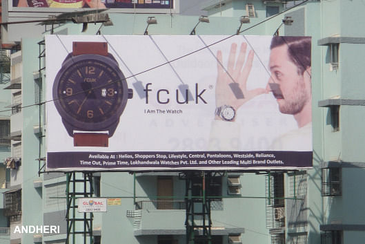 Man on bench watching landscape on urban billboard Stock Photo - Alamy