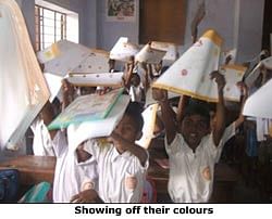 School children put colours into Hajmola Candy