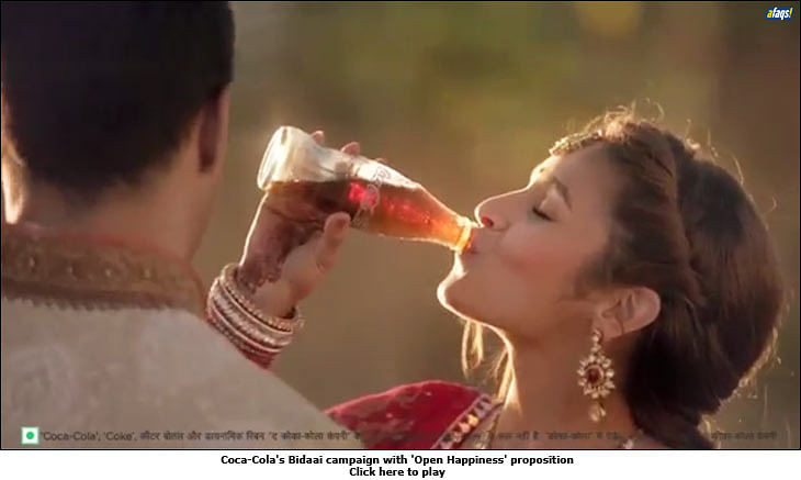 Coca-Cola replaces 'Open Happiness' with 'Taste the feeling'