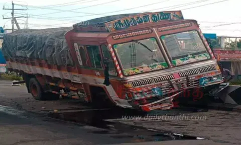 அந்தியூரில் தடுப்புச்சுவரில் மோதிய லாரி