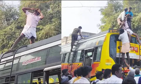 பஸ்சின் மேற்கூரையில் ஏறி மின்வயரை கடித்த வாலிபர்.. பயணிகள் பீதி