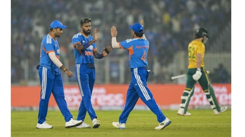 
India's Hardik Pandya, centre, with teammates celebrates the wicket of South Africa's Dewald Brevis during the fifth T20 International cricket match of a series between India and South Africa, at Narendra Modi Stadium in Ahmedabad, Friday, Dec. 19, 2025 

