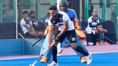  Harmanpreet Singh defends the ball during a exhibition match
