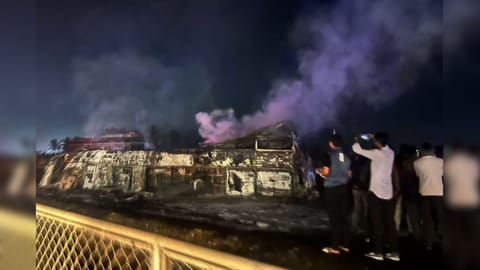 Charred remains of a bus after it caught fire following a collision with a speeding truck, in Chitradurga, early Thursday, Dec. 25, 2025. At least nine persons were killed in the incident