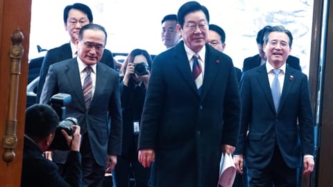 South Korean President Lee Jae Myung, center, arrives at the presidential office Cheong Wa Dae, or the Blue House in Seoul (AP)