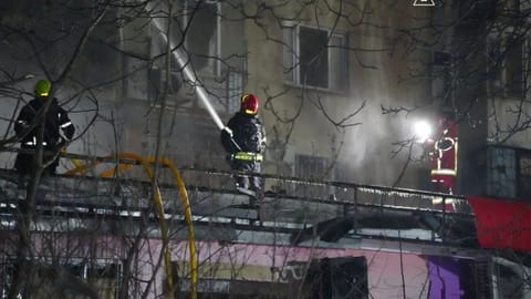 Emergency services personnel work to extinguish a fire following a Russian attack in Odesa, Ukraine, Wednesday, Dec. 31, 2025. 