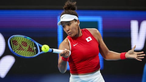 Naomi Osaka returns a shot to Maria Sakkari during their United Cup tie 