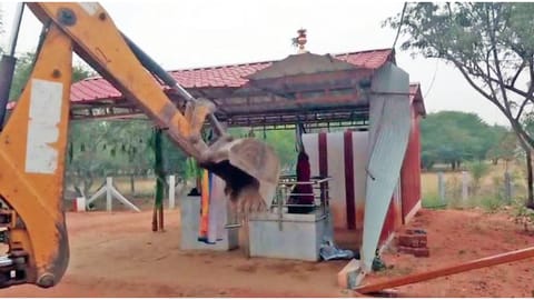 Earthmover in action on a poramboke land near Perumanallur