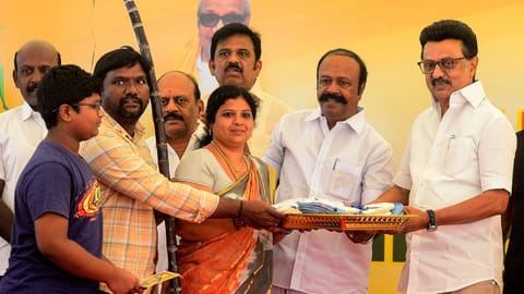 Chief Minister MK Stalin handing over Pongal kit to beneficiaries at a PDS shop in Alandur on Thursday