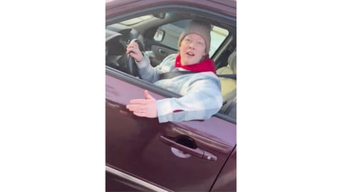 This image from video made by Immigration and Customs Enforcement officer Jonathan Ross via Alpha News shows Renee Good in her vehicle in Minneapolis.