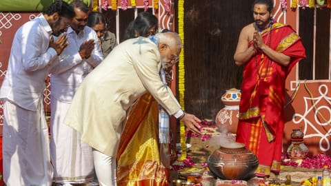 Prime Minister Modi performs rituals as Union Ministers G Kishan Reddy and L Murugan look on during Pongal celebrations in New Delhi