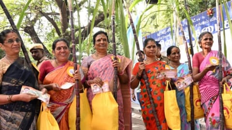 Women seen receiving their Pongal gift hamper