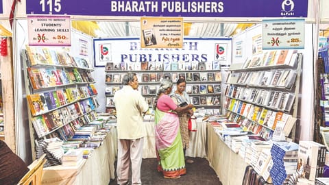 Bharath, author of Kuralukku Kural, and his stall at the book fair