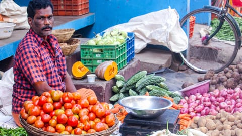 Image of a man selling vegetable used for representative purpose 