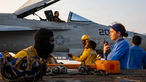 This handout photograph from the U.S. Navy shows sailors taxiing an F/A-18E Super Hornet on the flight deck of the Nimitz-class aircraft carrier USS Abraham Lincoln in the Indian Ocean on Jan. 25, 2026. 