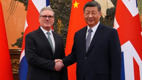 Britain’s Prime Minister Keir Starmer, left, shakes hands with Chinese President Xi Jinping ahead of a bilateral meeting in Beijing, China.
