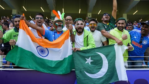 Cricket fans cheer during an ICC Champions Trophy 2025 cricket match between India and Pakistan, in Dubai, UAE 