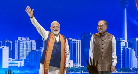 Prime Minister Narendra Modi along with his Malaysian counterpart Anwar Ibrahim participates in a community programme, in Kuala Lumpur, Malaysia. 