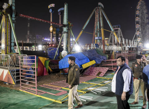 Police personnel at the spot after a swing fell down at Surajkund fair, in Faridabad, Saturday, Feb. 7, 2026. A police officer was killed and 13 other suffered injuries.