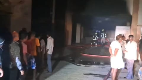 Firefighters spraying water on the burning cylinder at the Thirukazhukundram GH.