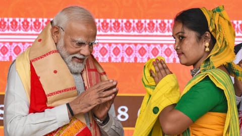 Prime Minister Narendra Modi being felicitated during a BJP workers meeting in Guwahati