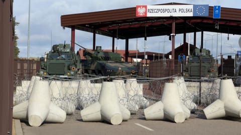 Armoured vehicles are parked at a section of Poland - Belarus border near the Polowce-Pieszczatka, Poland.
